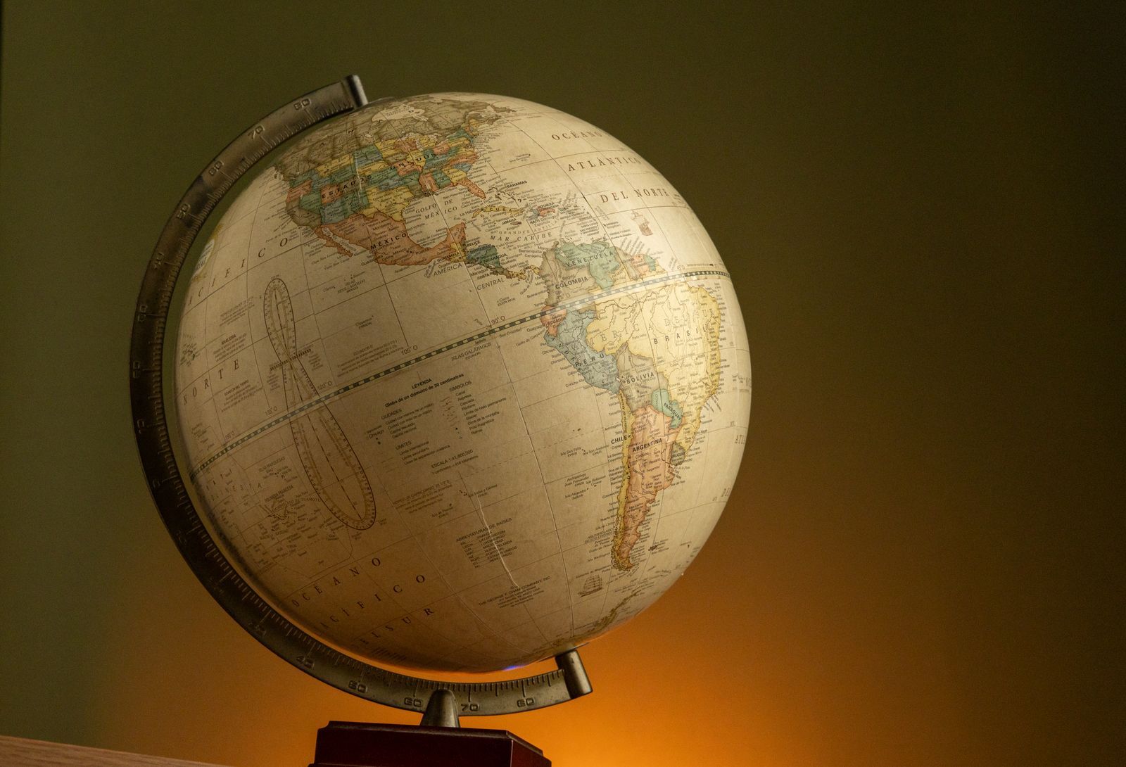 A world globe on a wooden stand